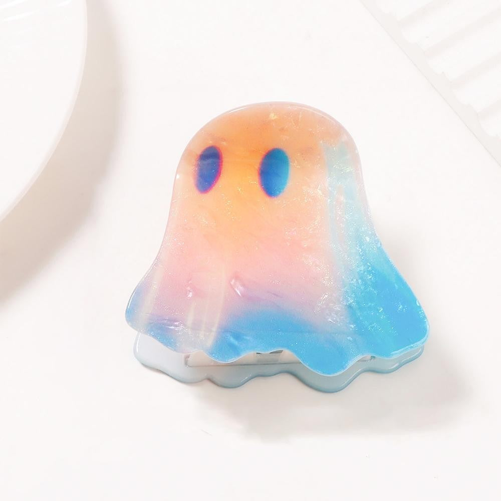 Ghost-shaped claw hair clip molded in glossy acrylic with a soft marbled ombre finish