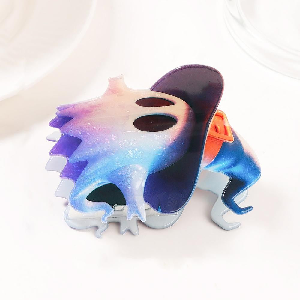 Ghost-shaped claw hair clip molded in glossy acrylic with a soft marbled ombre finish Witch